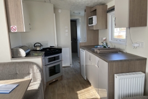 [Holiday caravan, Norfolk, kitchen.]