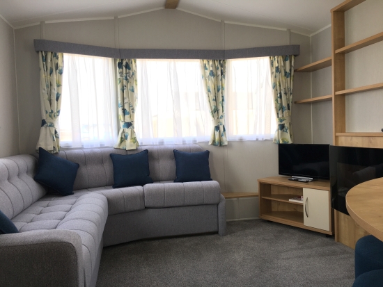 Photo of a living room in one of our holiday caravans